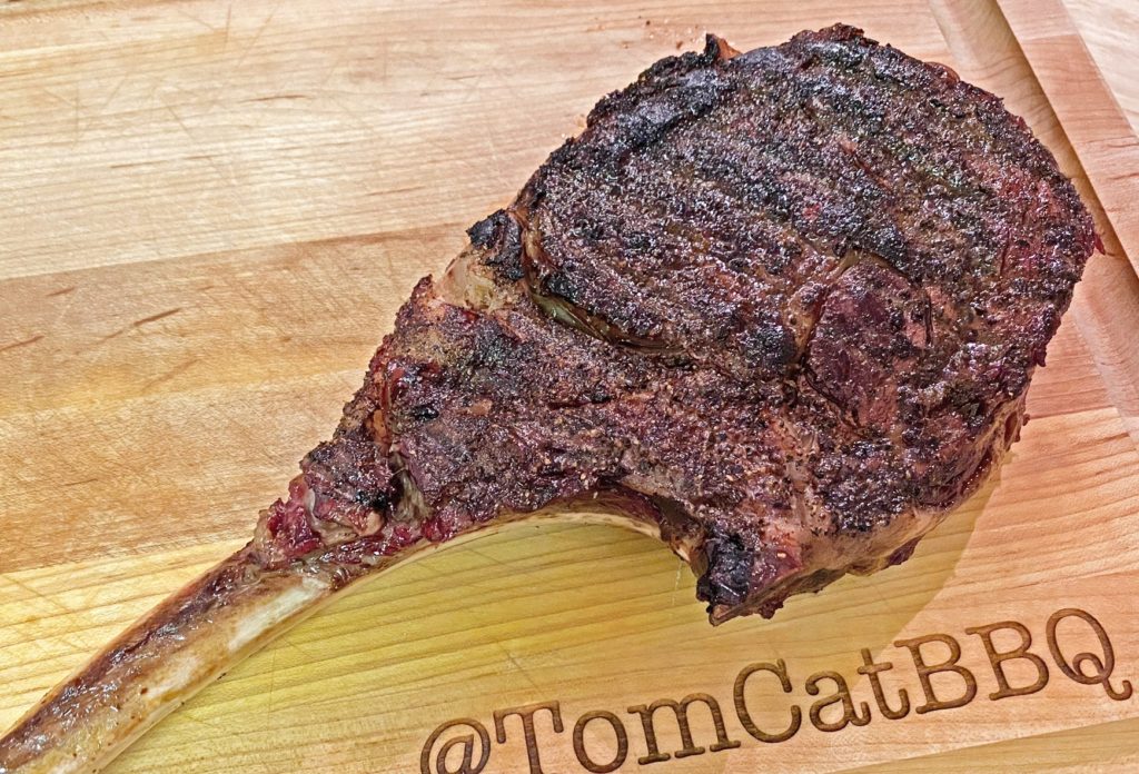 seared ribeye steak resting on a cutting board